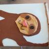Tactile image of a sloth made with felt, fabric, and wax shapes