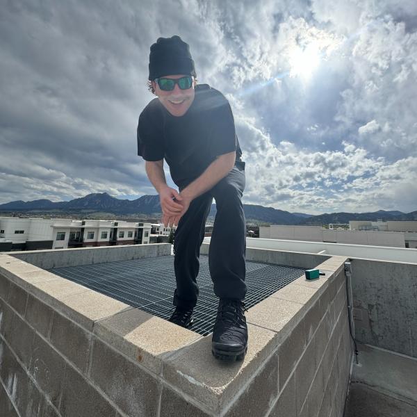 Connor Standing on Building