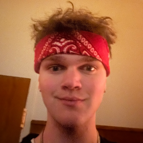 Portrait of a man with a red bandanna on