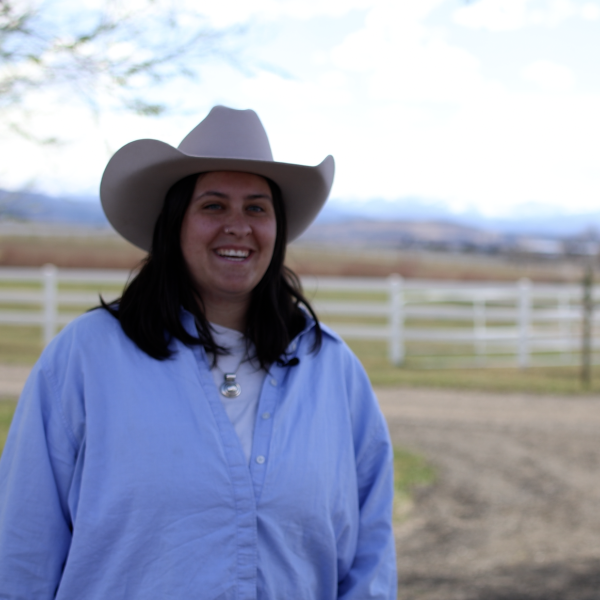 Person on a ranch with a hat