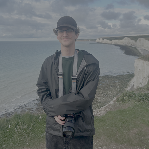 Max Standing in Front of Cliff