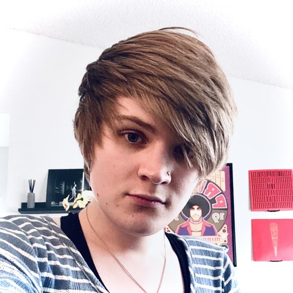 Portrait of a person in a striped shirt