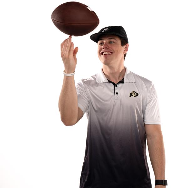 John Balancing Football
