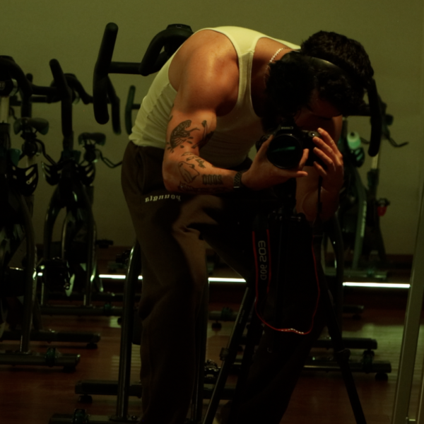 man flexing in front of a mirror