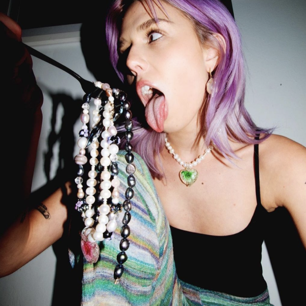 pink haired girl with tongue out