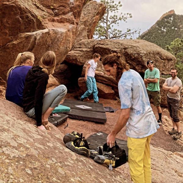 Rock climbers by red boulders