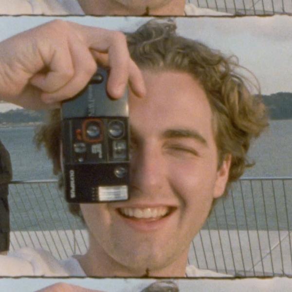 man holding a camera to his face
