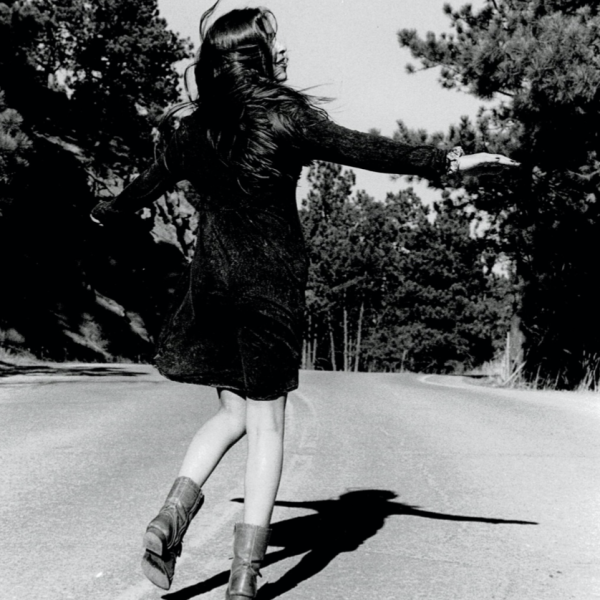Woman skipping down the street