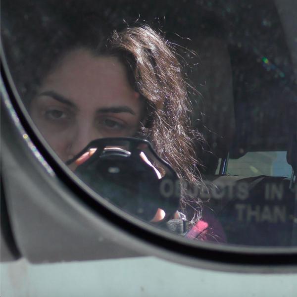Artist in car with video camera