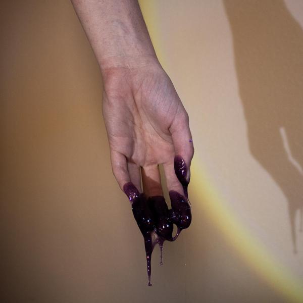 hand with black fluid