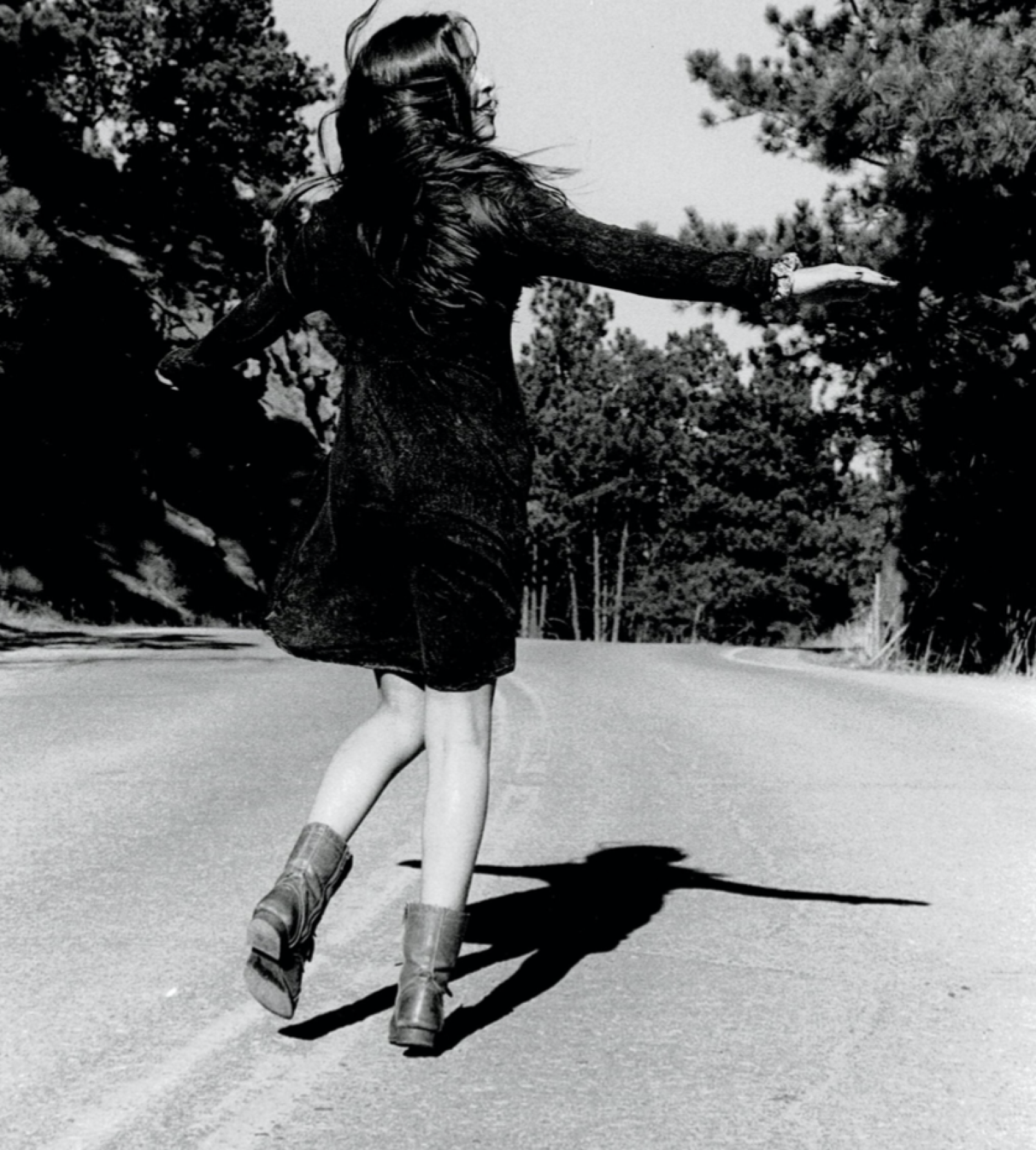 Woman skipping down the street