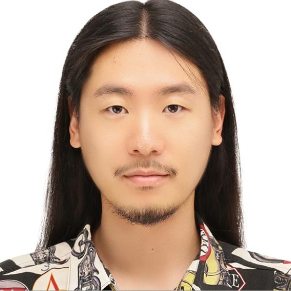 증명사진 - Hwanseo Yu - A portrait of a person with long hair, mustache, and beard, wearing a black and white patterned shirt.JPG