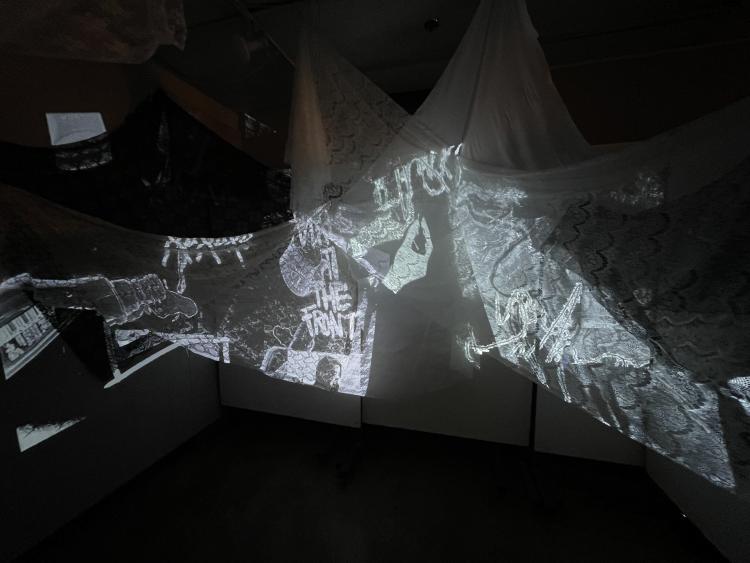 art installation of a video projection on fabric