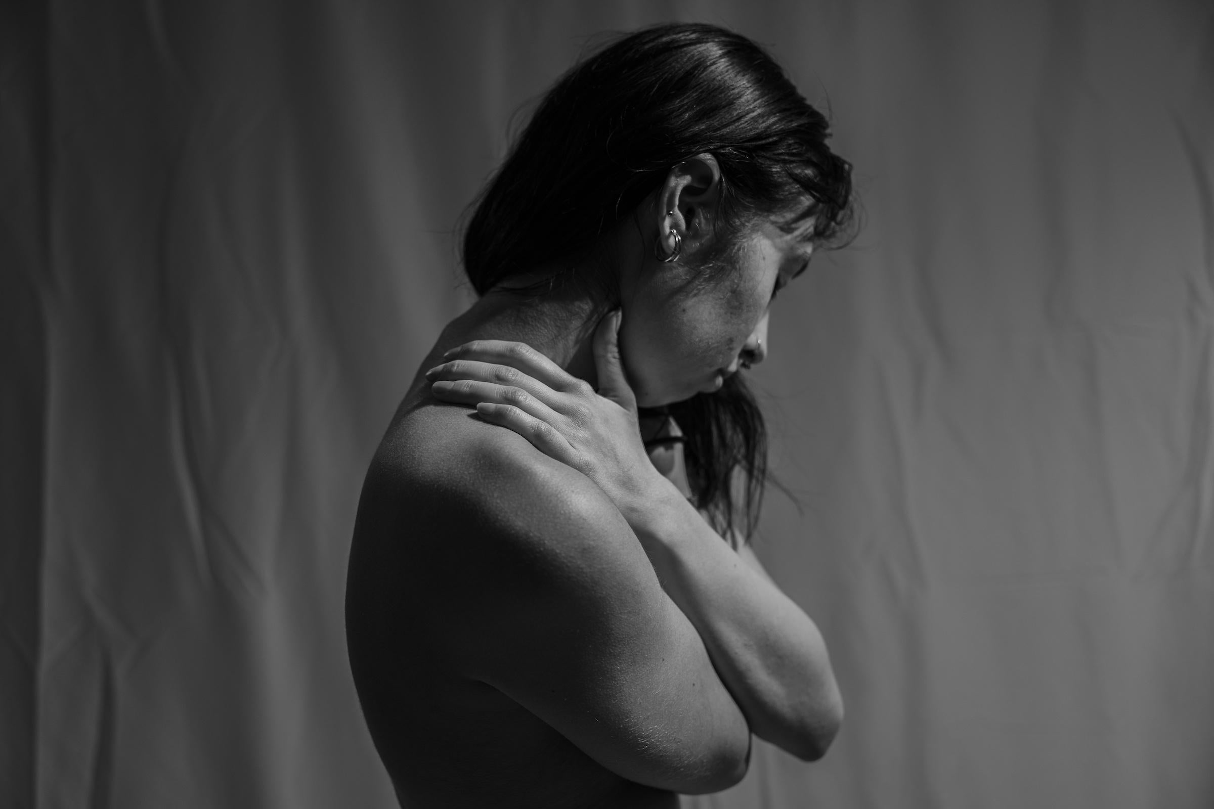 My photoshoots were split into head shots (close-up headshots) and body shots (more expanded). The emotion behind each shoot was a mixture of anguish and tranquility depending on the poses I was placing my subject in. This specific photo is a way I would comfort myself in moments of stress, by holding the back of my neck.