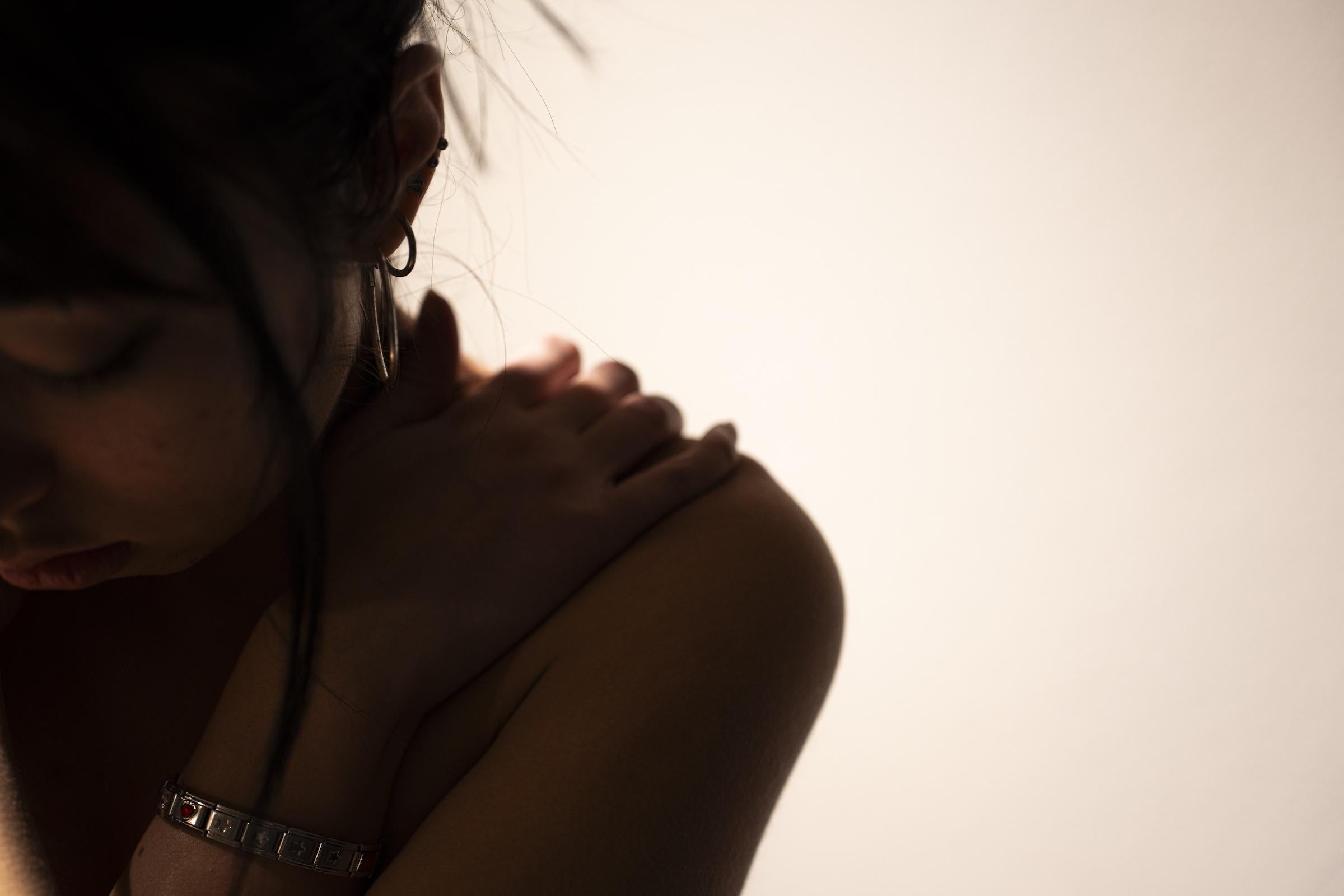 Image 02 is a similar position of comfort in a moment of stress, but is instead a close-up headshot to incorporate the facial tranquility one can offer to themself in a moment of stress.