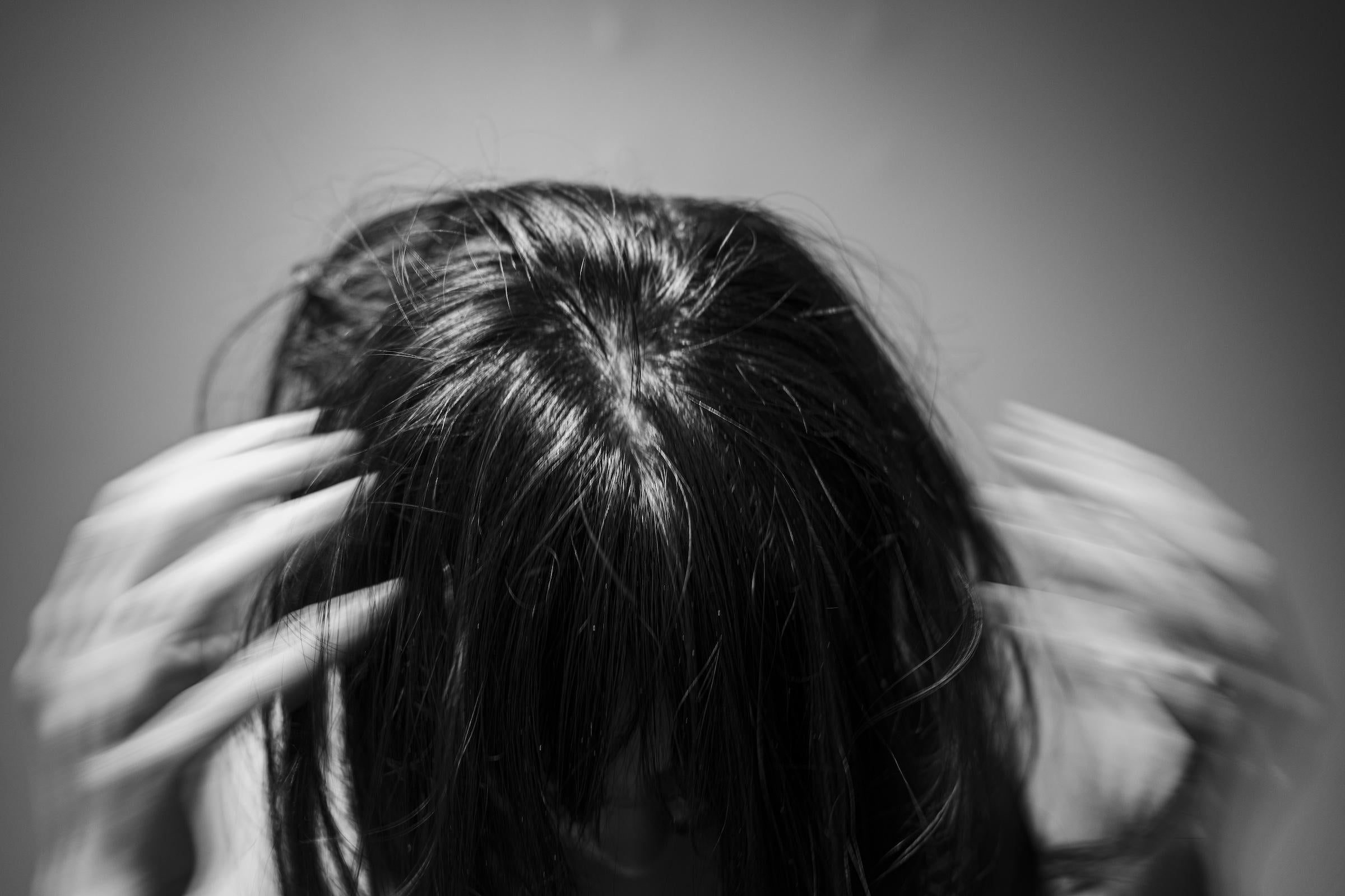 I took a series of headshots within one of my photoshoots like this with my subject's hair covering their face to show low shutter speed movement to depict the headspace an anxiety attack feels like where everything is just moving so fast and I can't ground myself to see who I actually am. This is one of my favorite photos I have taken throughout the course of this whole project