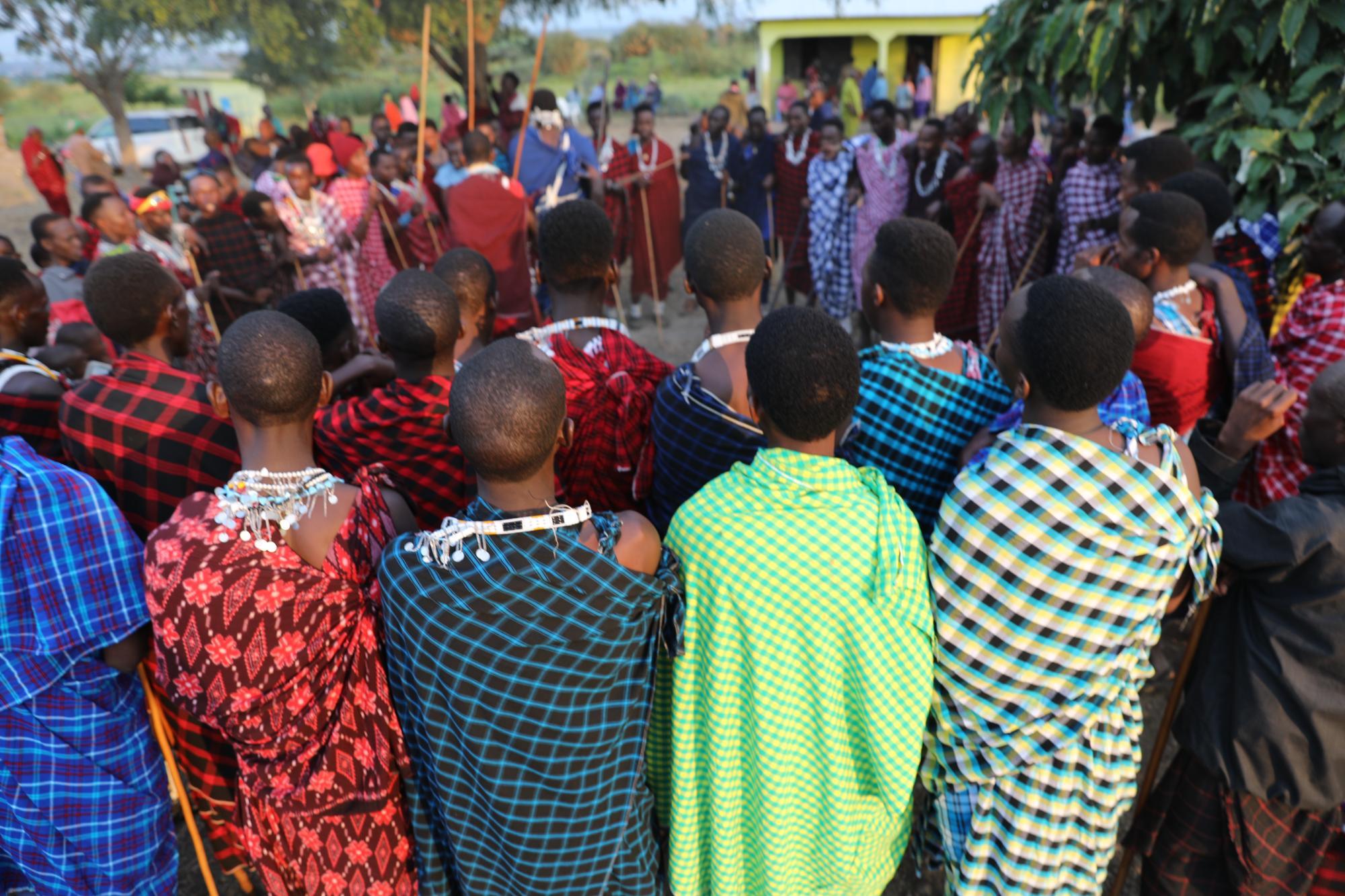 A large group of men gathered in a circle