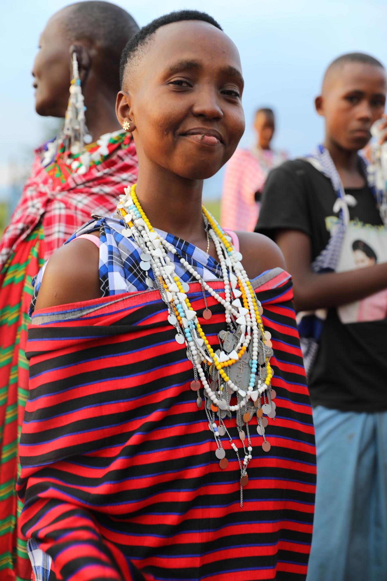 a woman wearing bright clothes and lots of jewelry