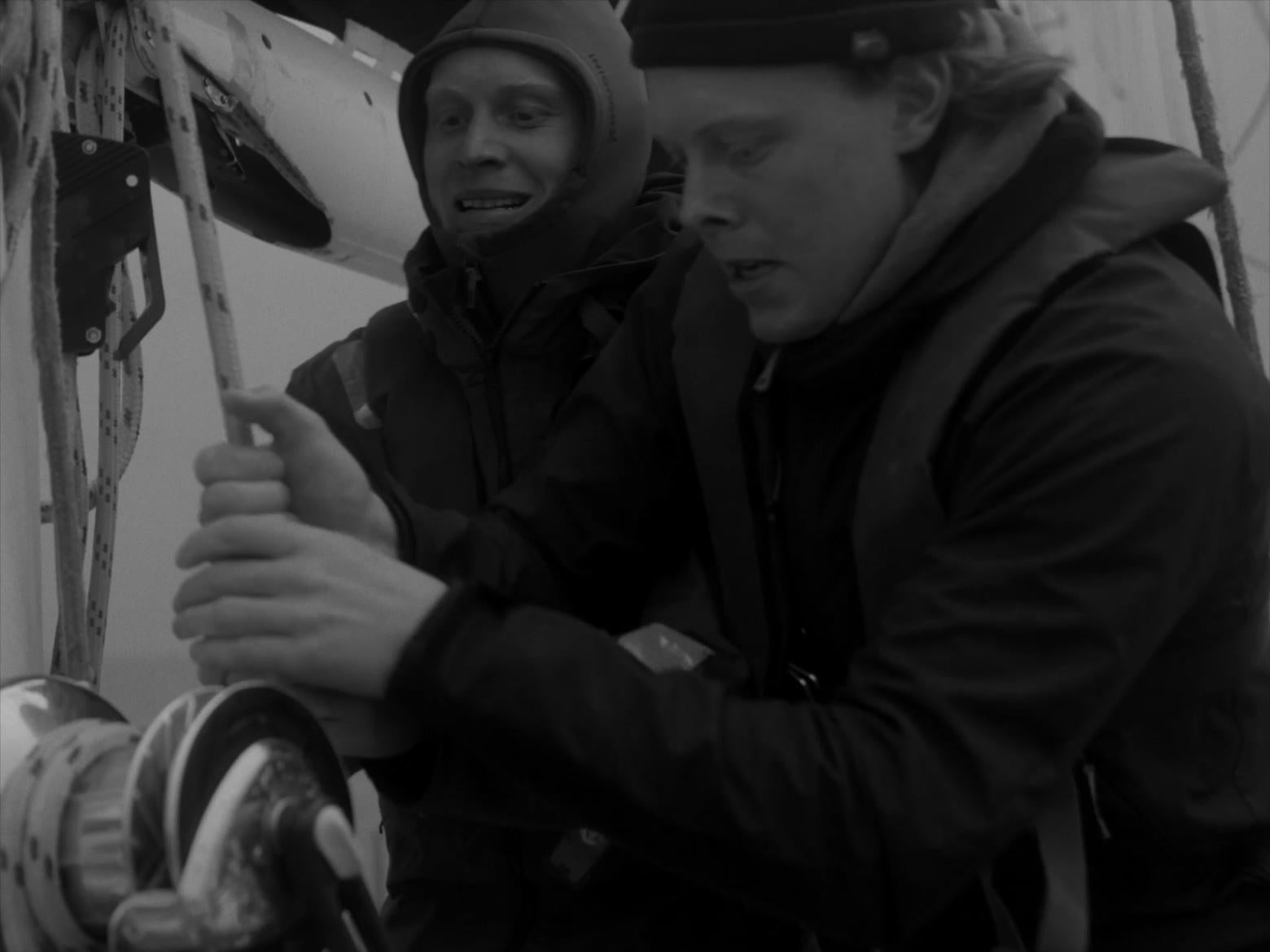 B&W two sailors setting the sails