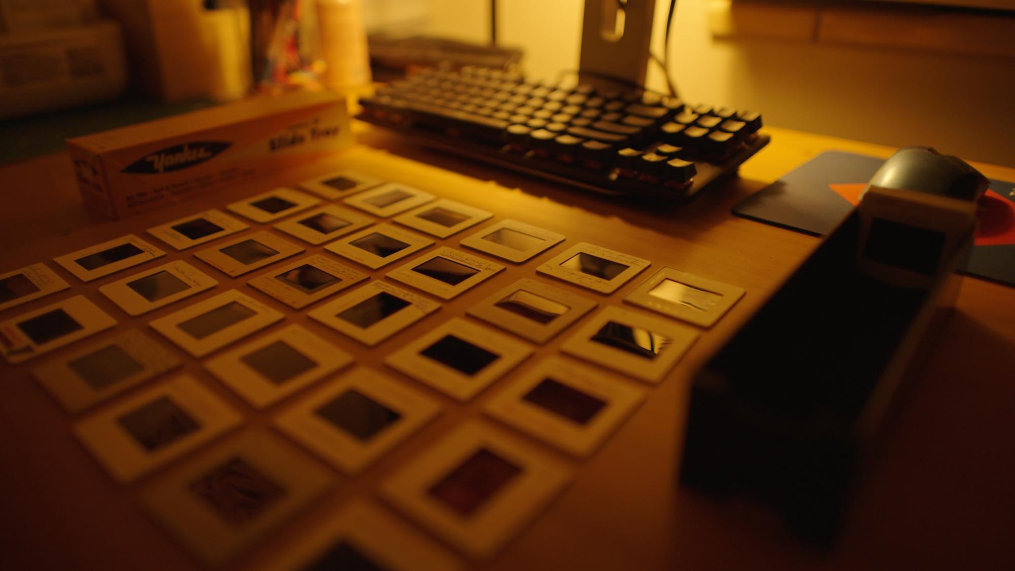 Film slides arranged on a desk in a 6 x 6