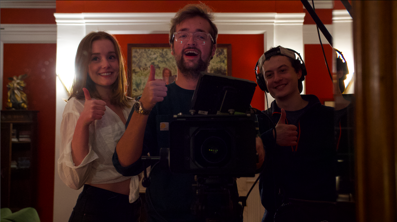 The people pose with their camera equipment