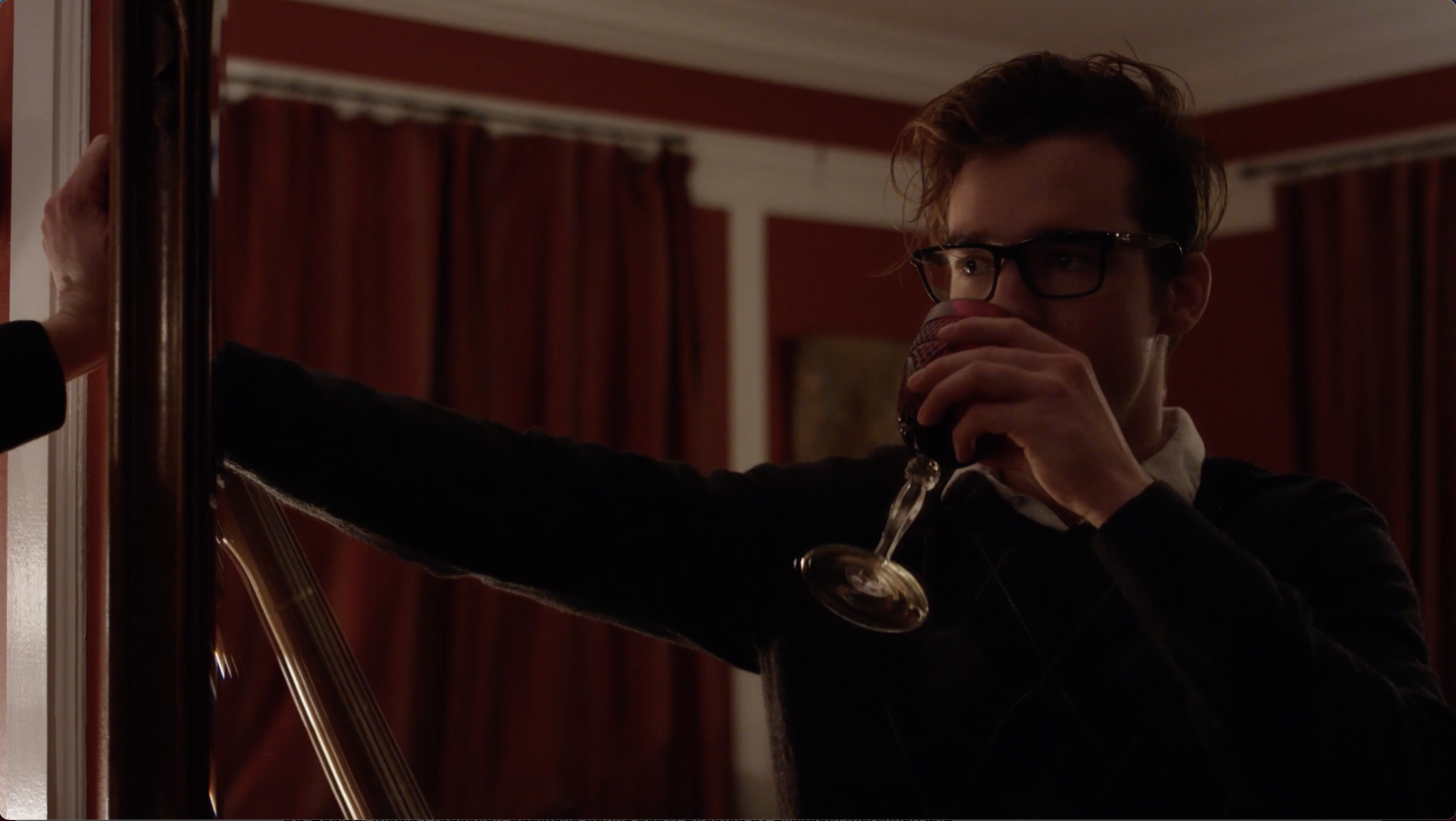 Man drinking a glass of wine