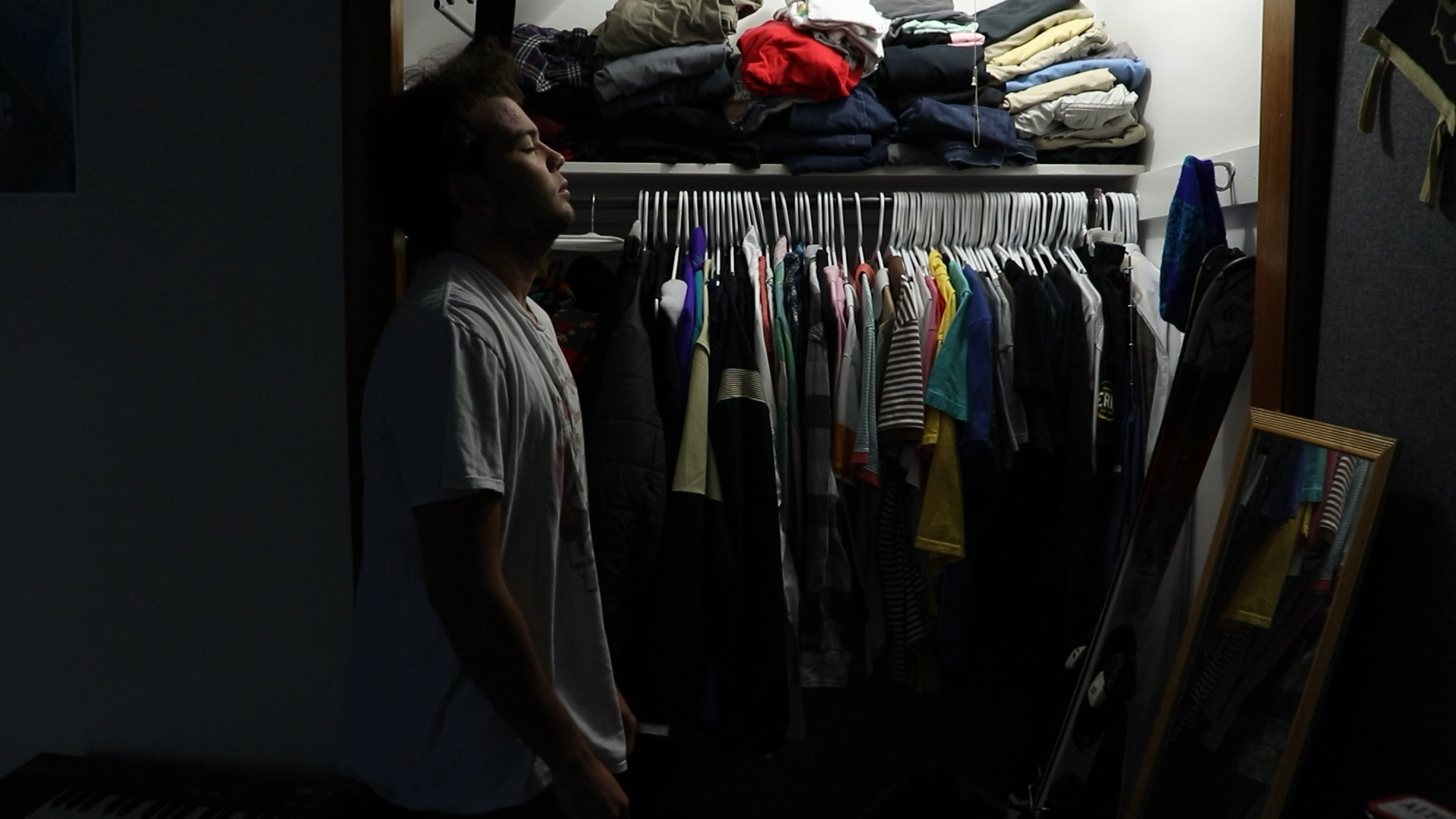 man standing in a walk-in closet