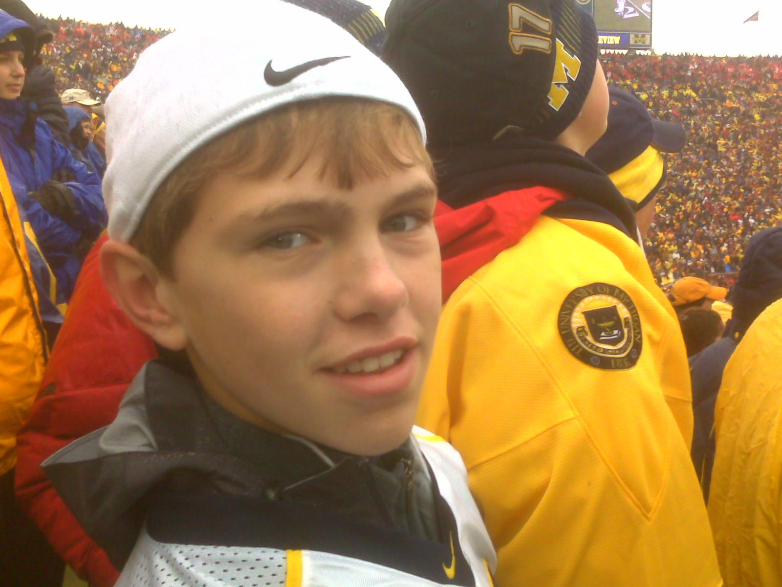 Kid in a crowd at a football game