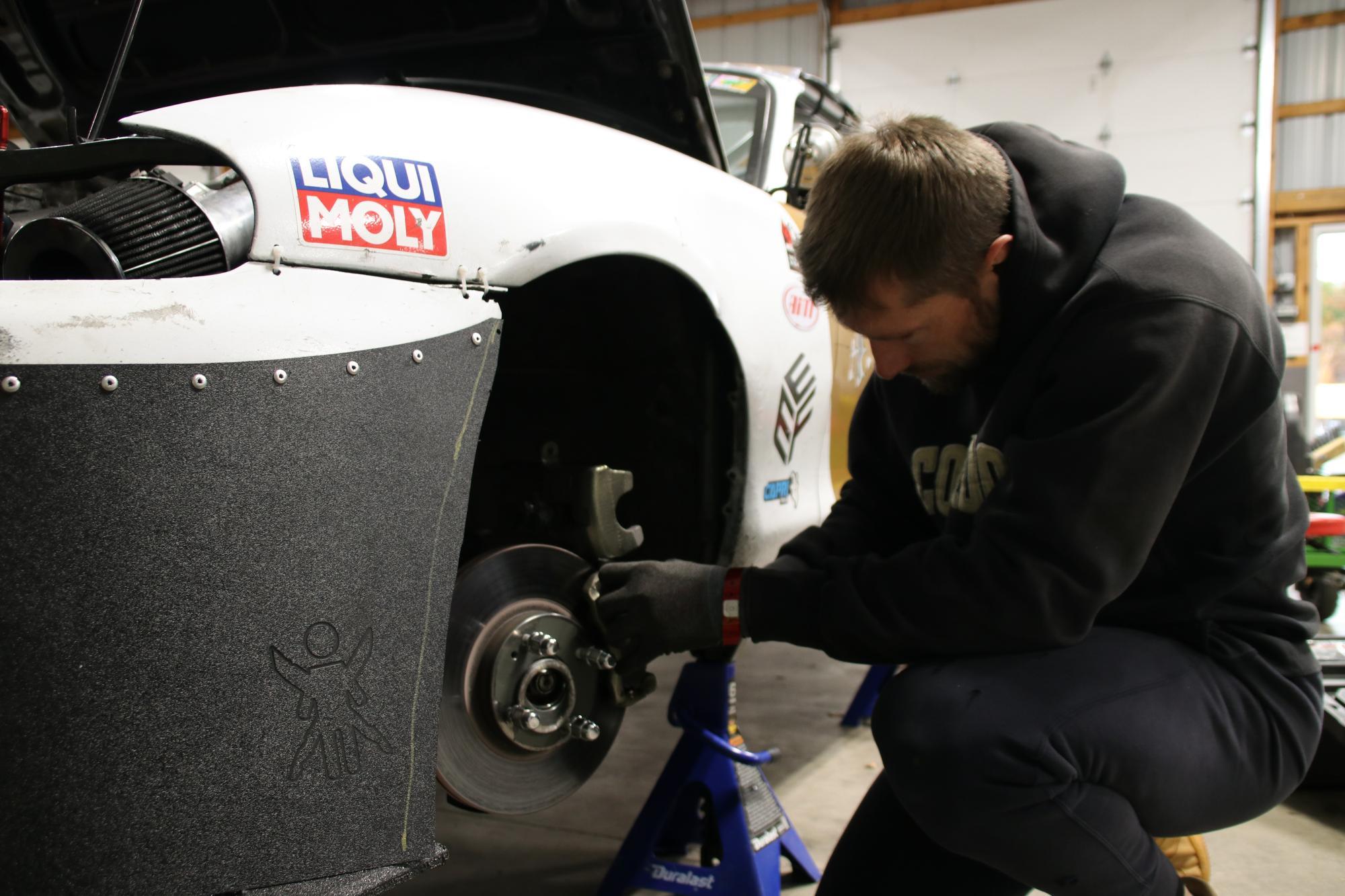 Henry works on replacing the brake pads before Sunday’s race