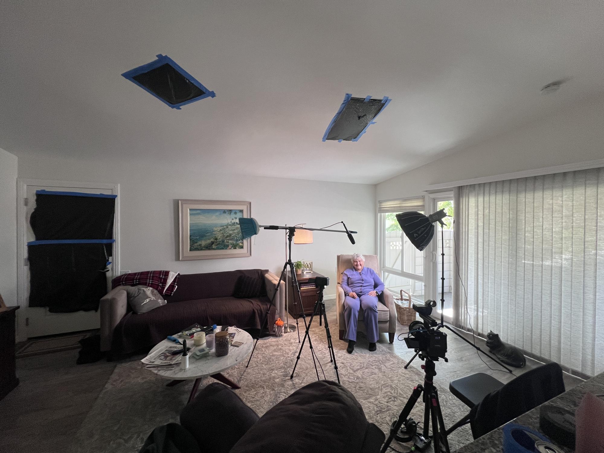 This is the interview setup that I made for my biological grandmother, Margie. This setup took some tinkering to get my desired look. I knew that I would run into continuity issues from leaving the window open. Although, I liked the added depth and it helped to achieve my desired ultra white look. There was some unwanted natural light coming in through overhead windows and the back door so I used trash bags to flag it off. As a second audio source, I again used my trusty "broom pole".