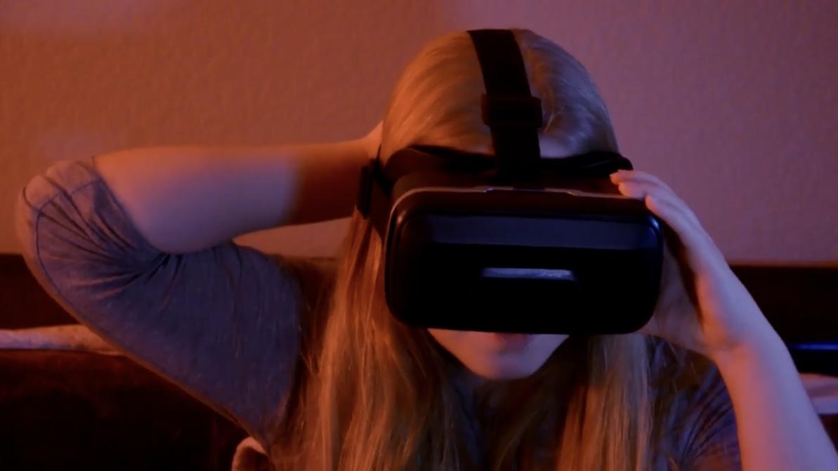 a woman wearing a virtual reality headset