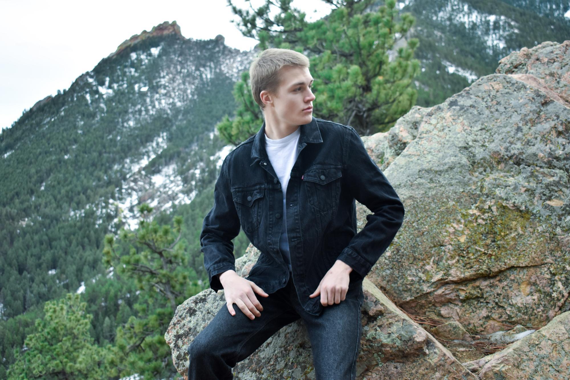 man sitting on a rock