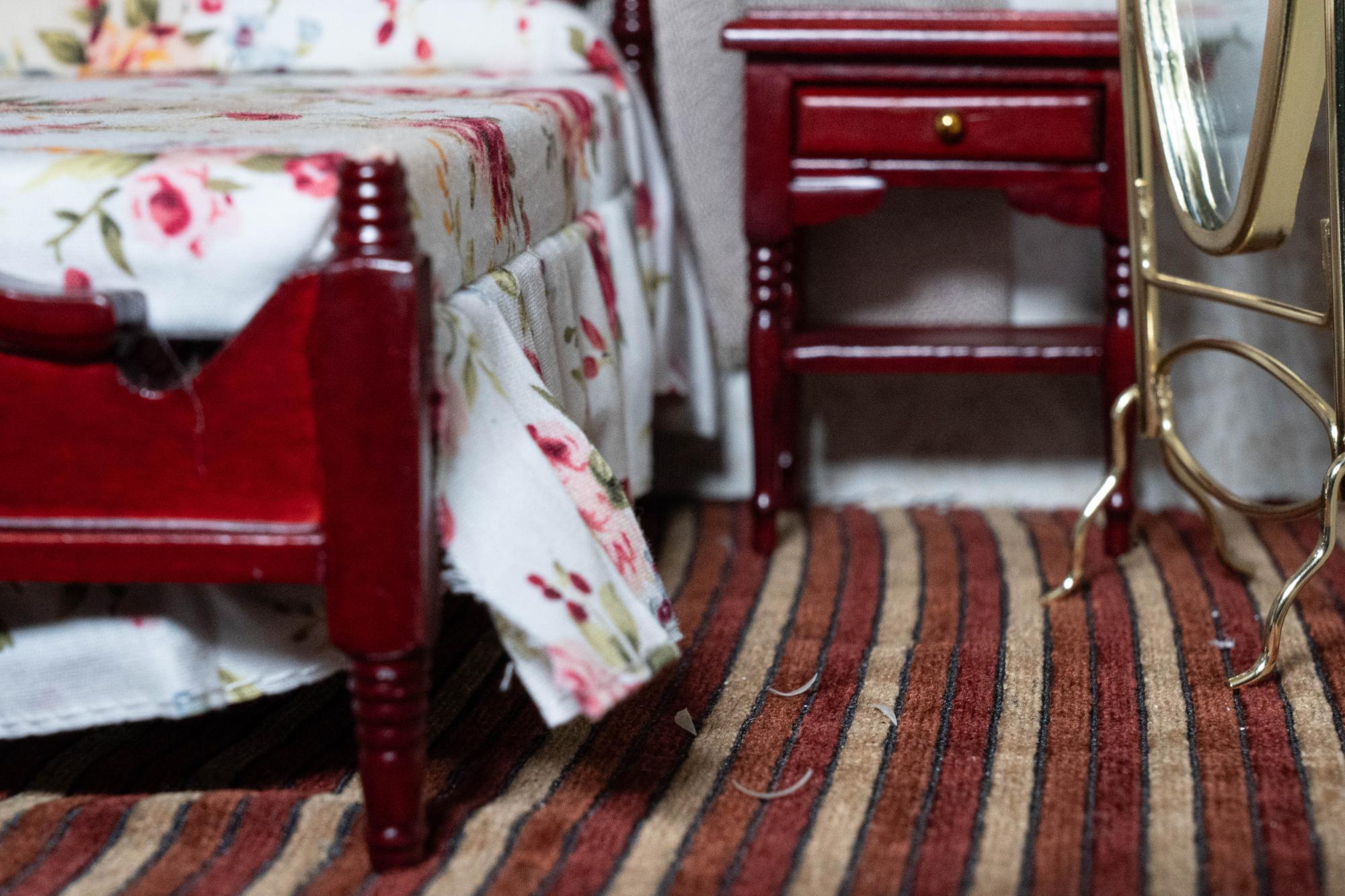 lose up shot of the motel room carpet littered with fingernail clippings