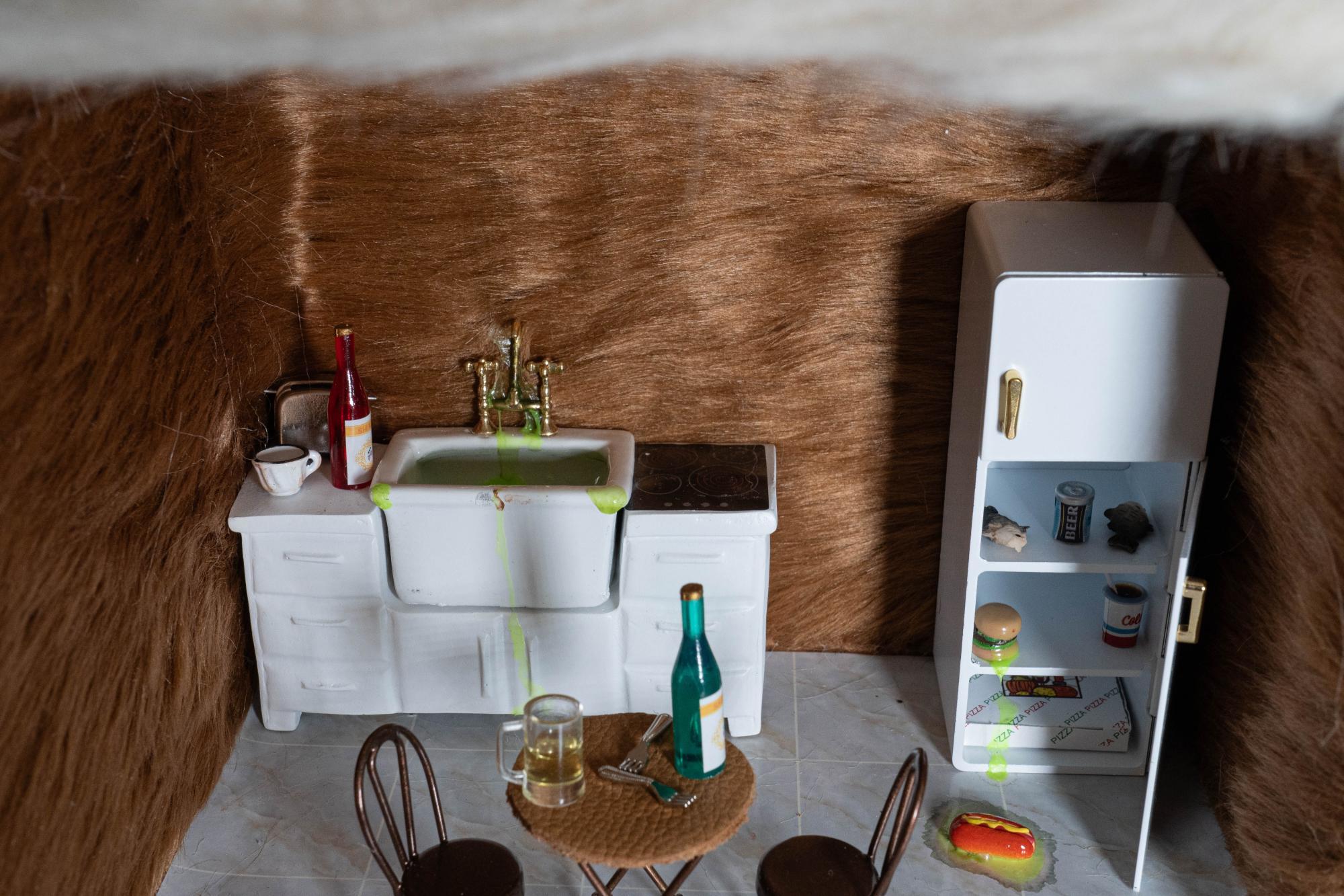 Wide shot of kitchen set with fur covering the walls