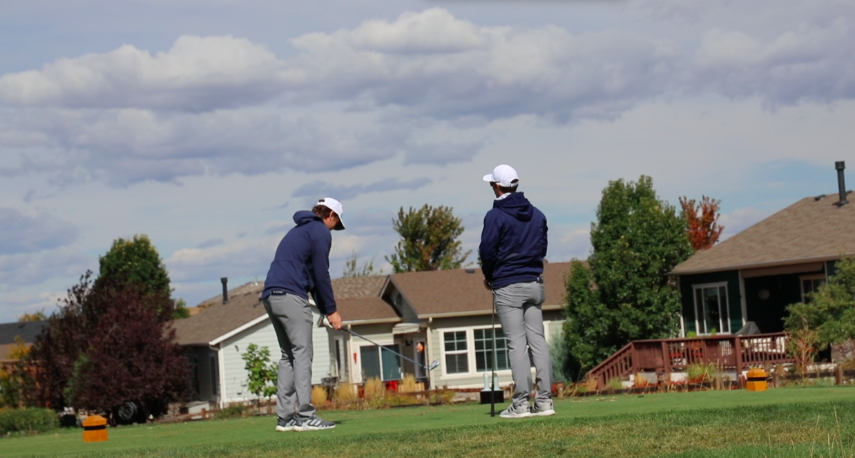 two men playing golf