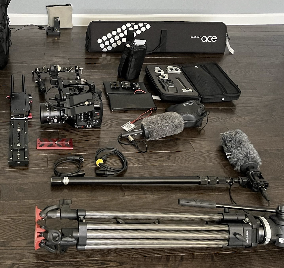 camera body, lenses, audio recorders, microphones, boom pole, & tripod