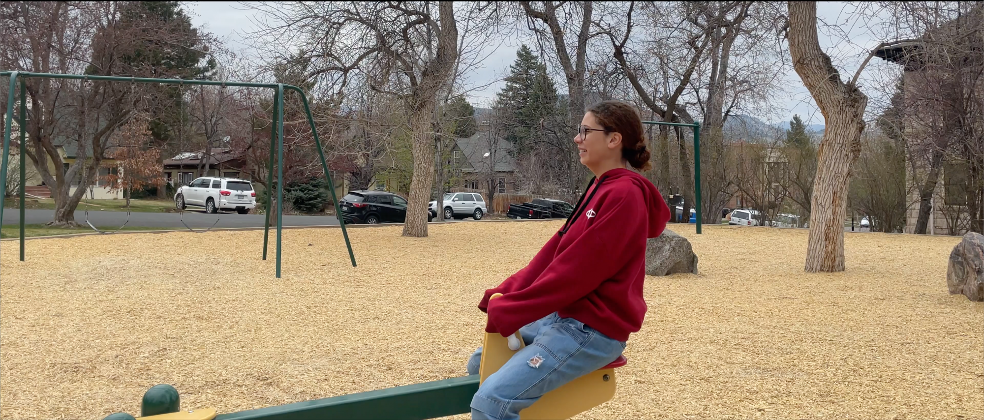 Person on a see-saw in a cemetery