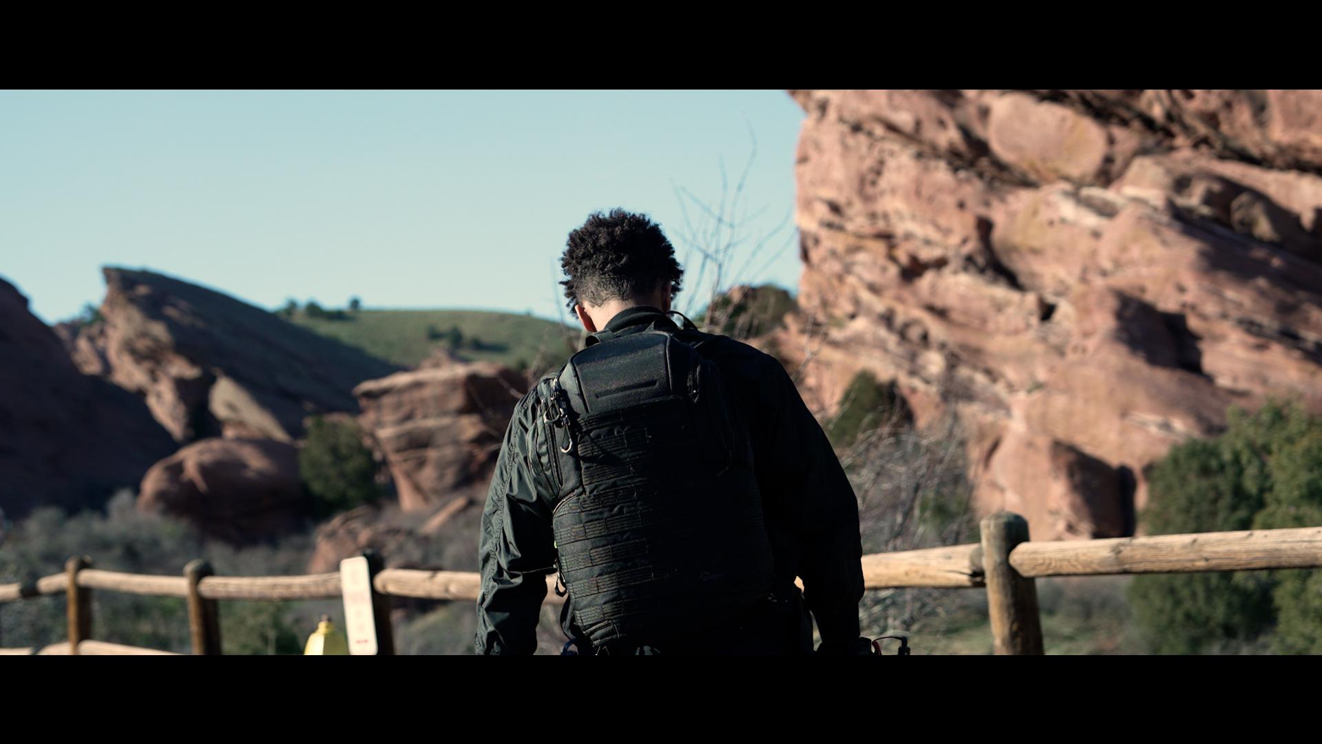 Forrest Mondlane (subject) walking up to Red Rocks Amphitheater