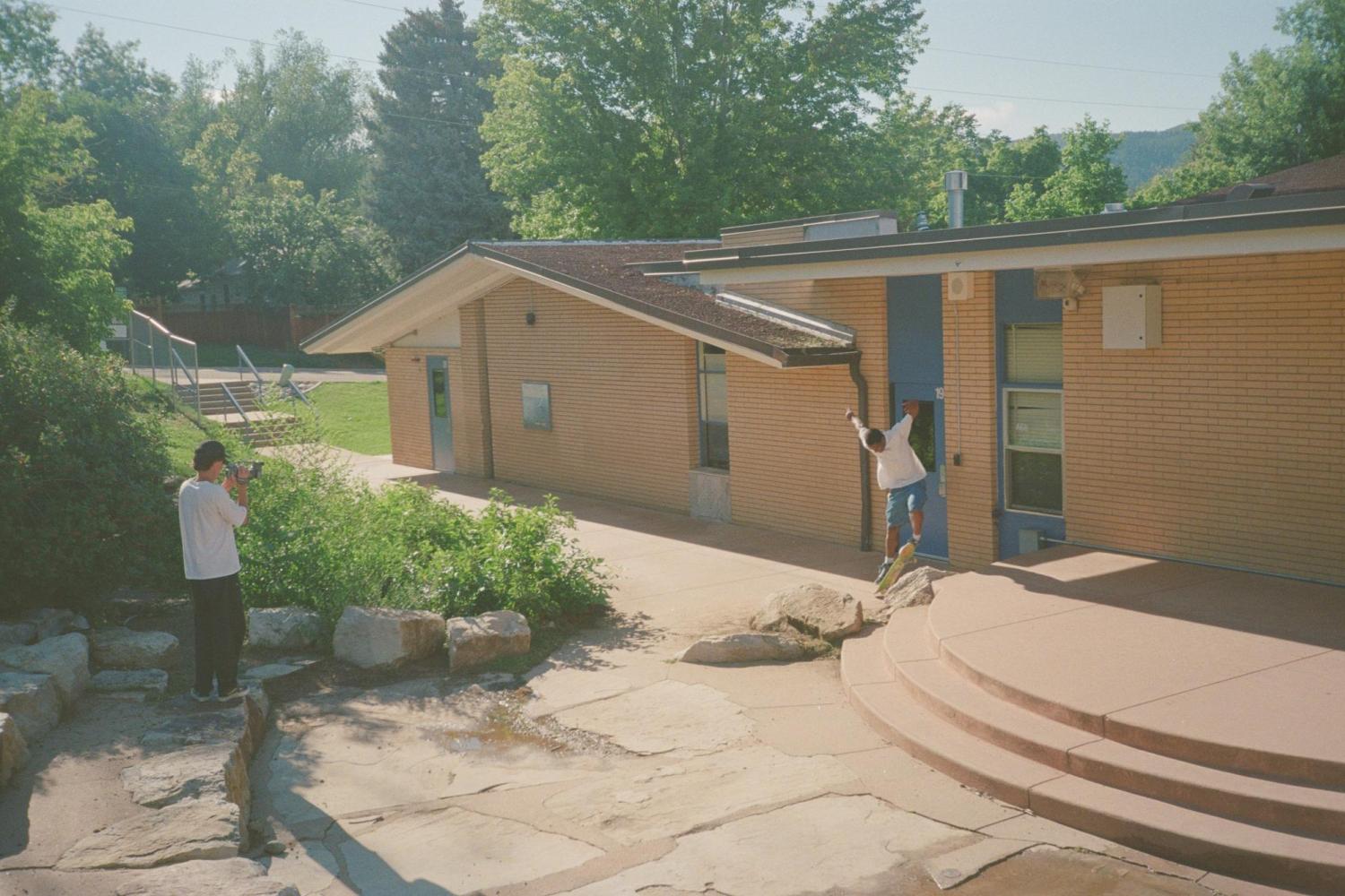 Filming Anthony do a switch flip fakie manny