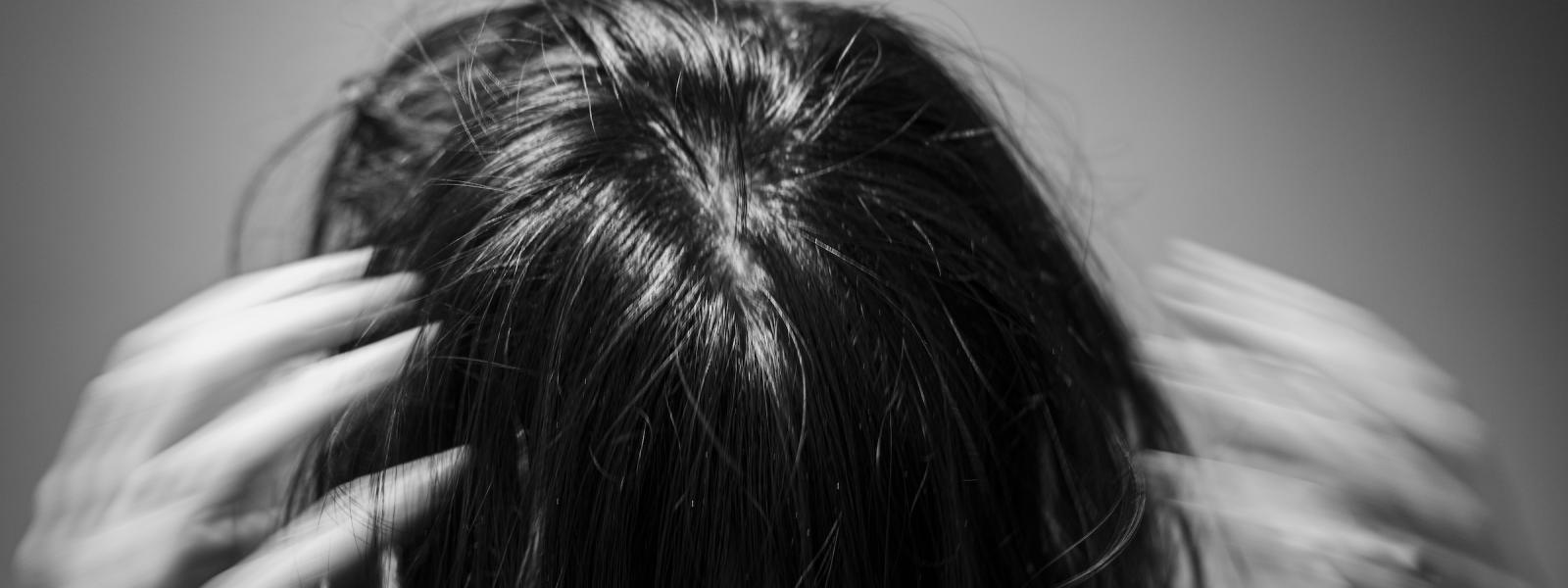 I took a series of headshots within one of my photoshoots like this with my subject's hair covering their face to show low shutter speed movement to depict the headspace an anxiety attack feels like where everything is just moving so fast and I can't ground myself to see who I actually am. This is one of my favorite photos I have taken throughout the course of this whole project