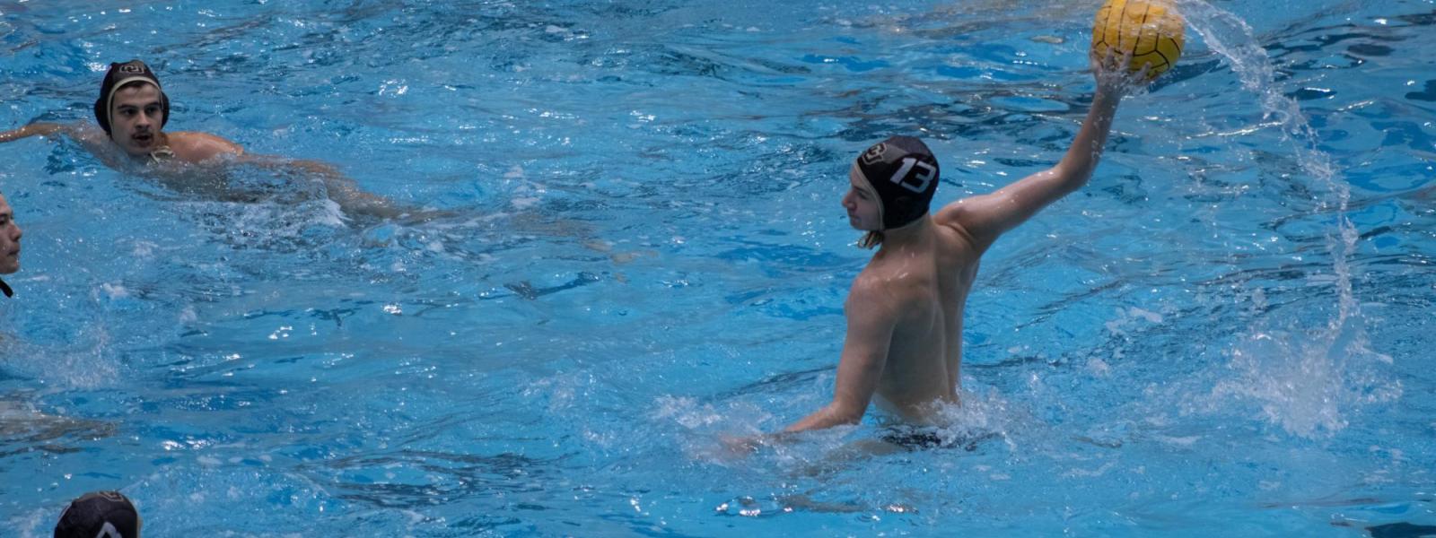 People playing water-polo in a pool