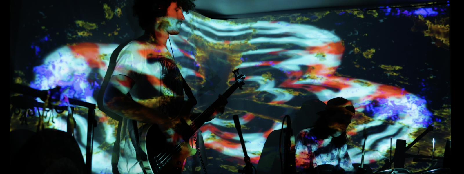 band playing with psychedelic projections