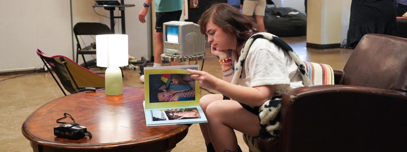 two women looking at artwork