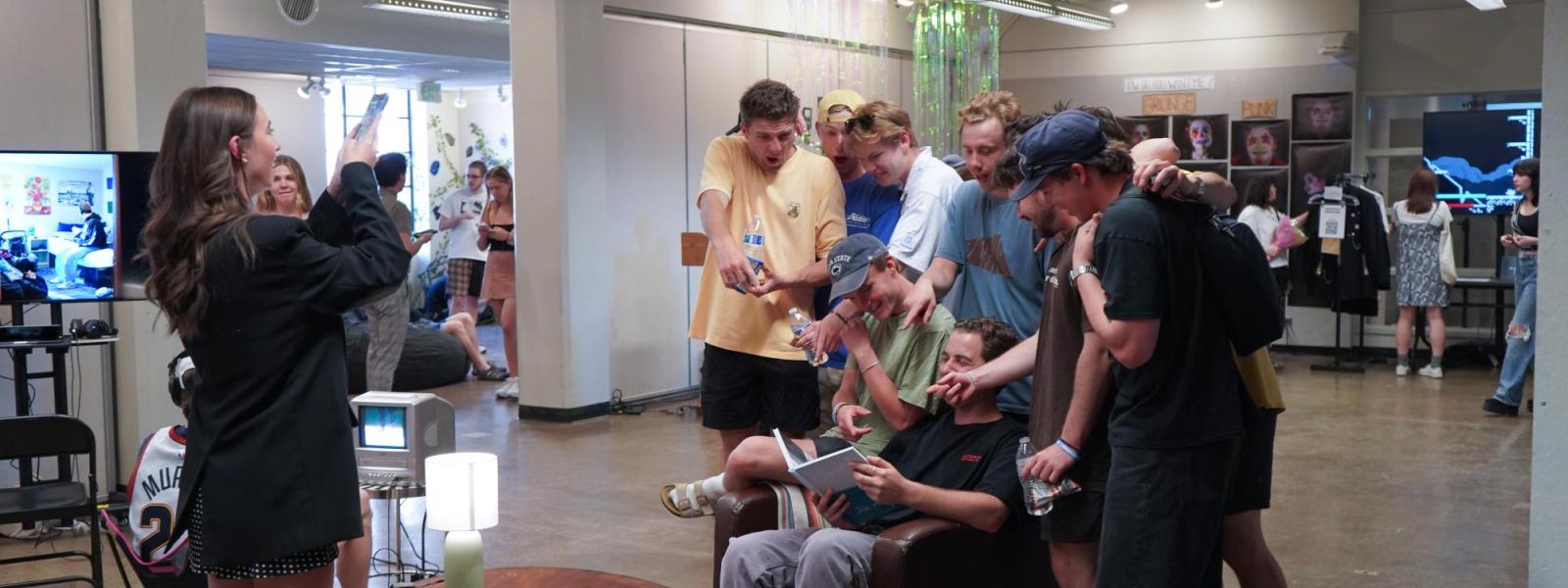 group of people looking at artwork