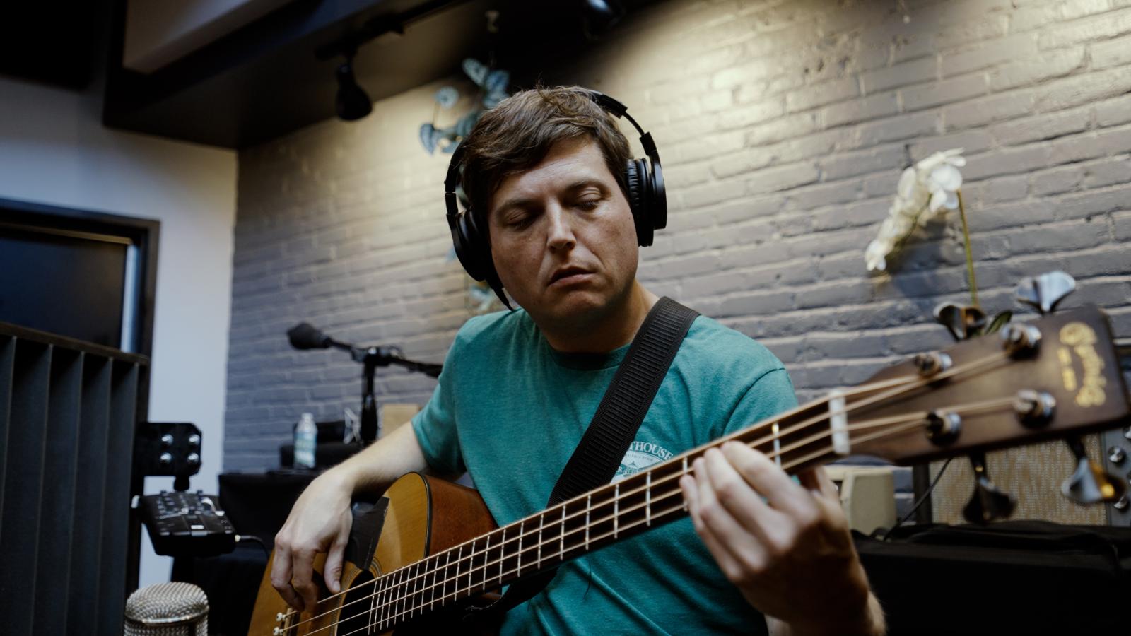 Bass player Tim Saxhaug playing his acoustic bass during recording