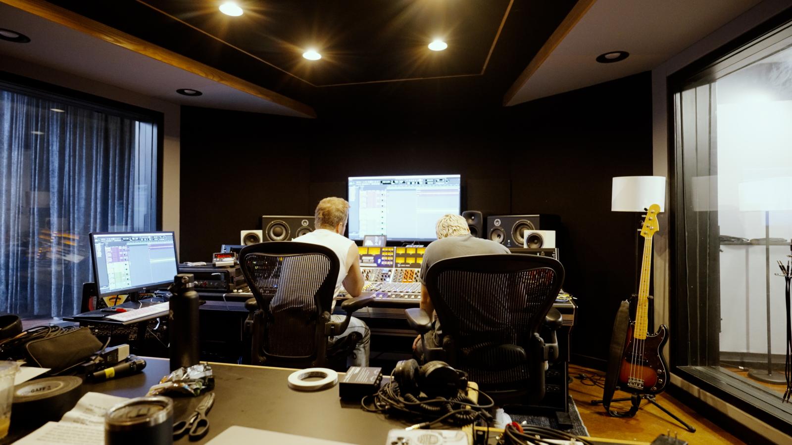 Josiah and Dave Simonett at the studio board going over what to add/redo
