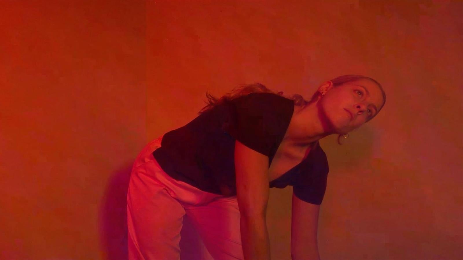 dancer crouching over