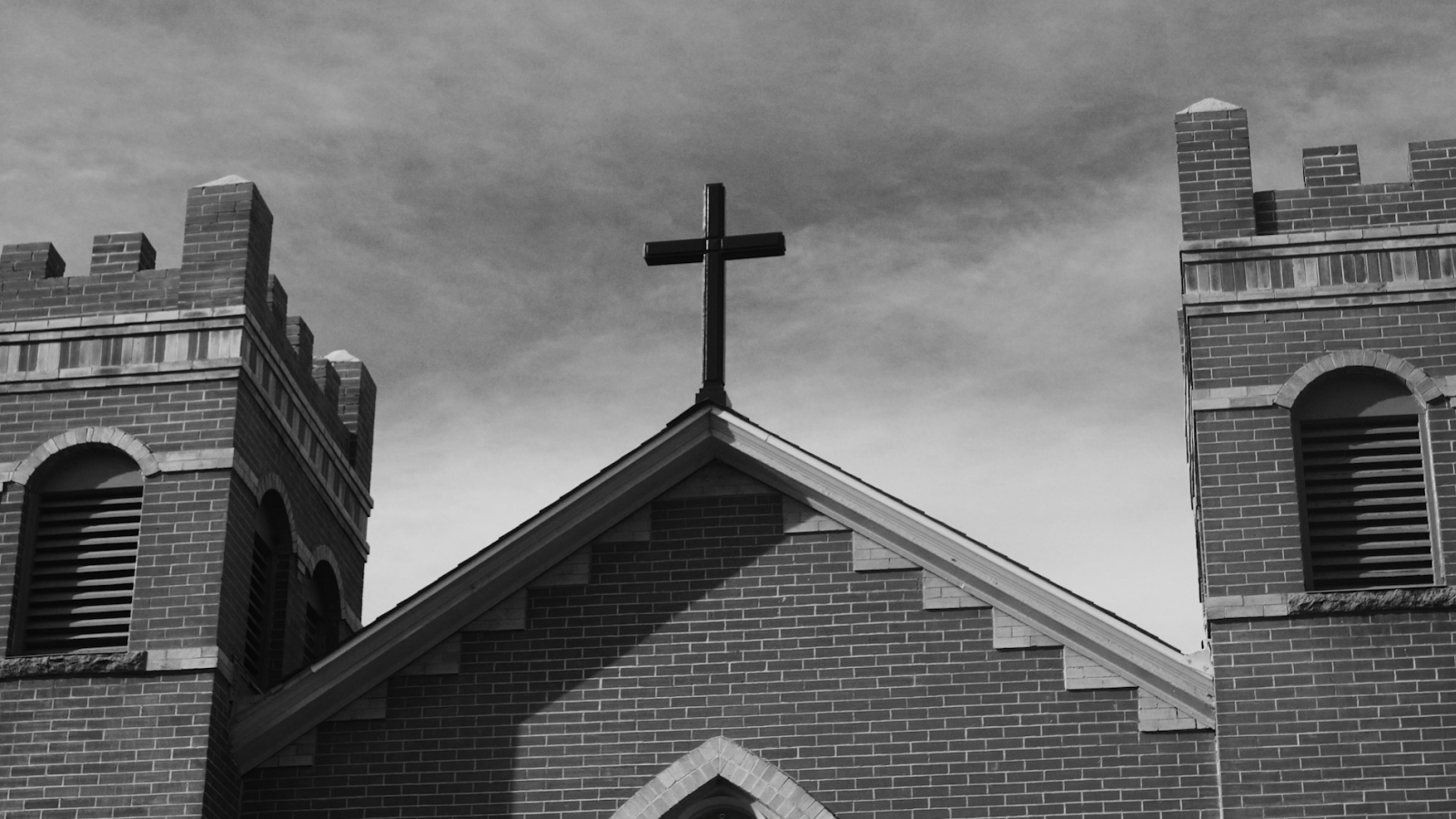 A cross on the roof of a church