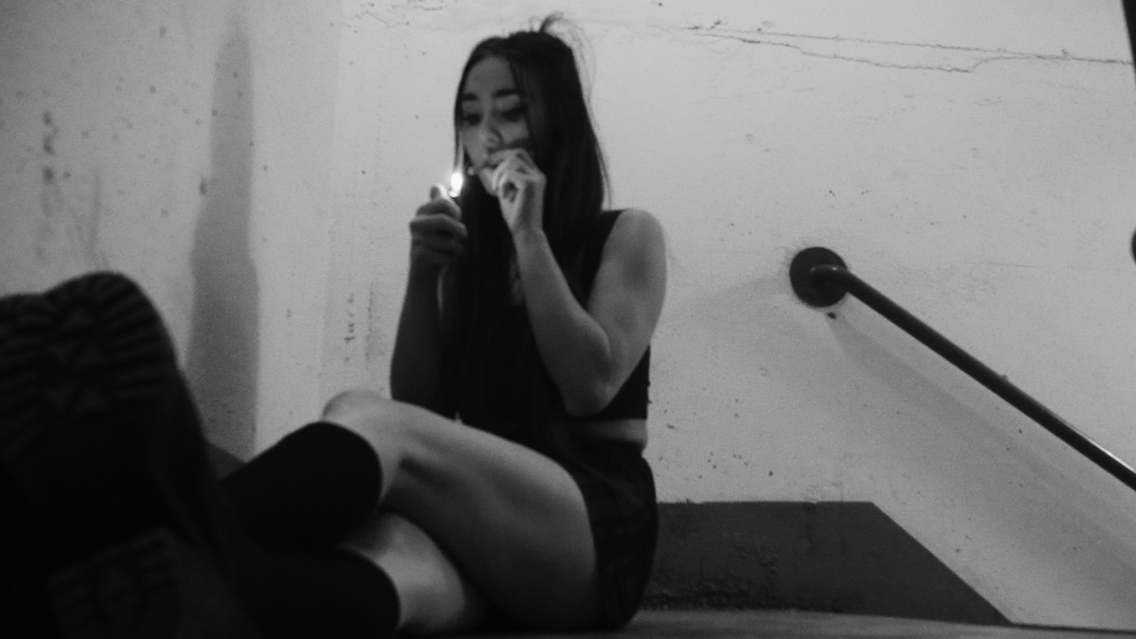 person lighting a cigarette