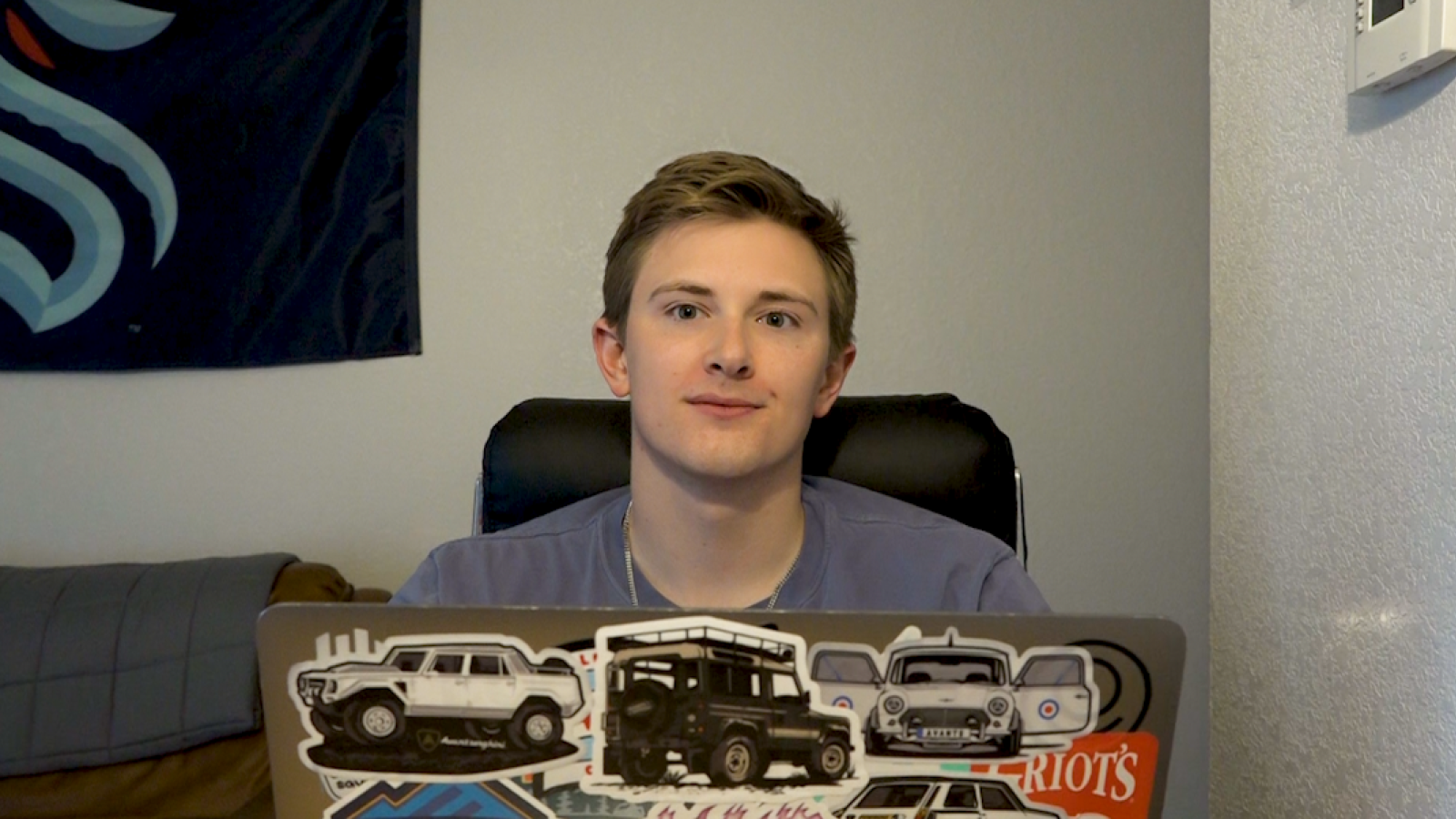 ustin Gets Sentimental: A seated Austin looks at the camera; there are heartfelt emotions in his eyes.